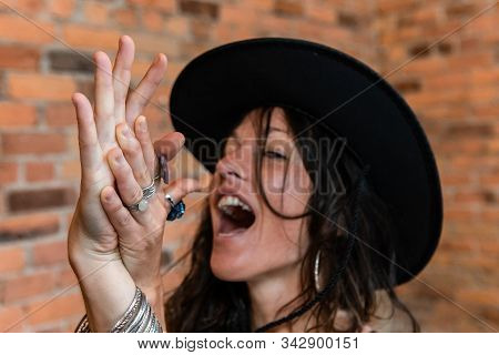 Hands Of A Carefree Woman Having Fun During A Yoga Workout With Eagle Posed Arms And Blurry Face Wit