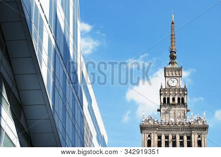 Geometric Reflection: Partly Cloudy Sky Reflected By Window Panes Of Office Building. Surface Of Gla