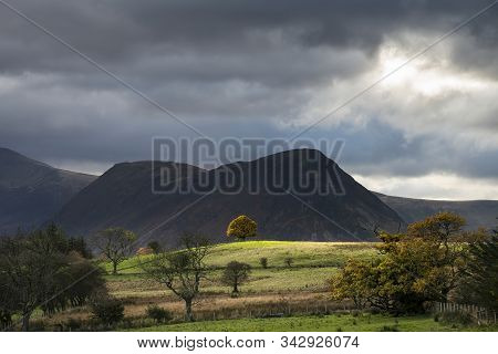 Stunning Autumn Fall Landscape View Along Valley Towards Mellbreak And Grasmoor In Lake District Wit