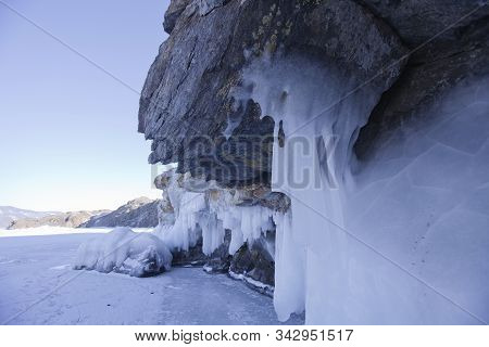 Large Icicles. Lake Baikal. Winter Frozen Nature