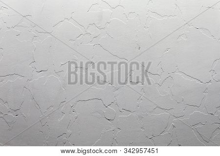 Abstract White Unostentatious Background And Texture. A Plaster Wall With Old Cracked Layer Under Ne