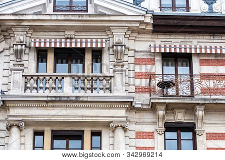 Facade Of A Historic Brick Building With Metal Balconies. Geneva, Switzerland - Image