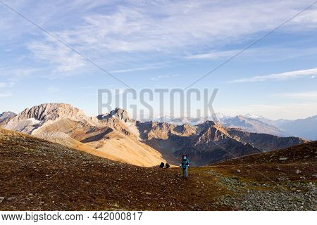 Bright Panorama Of The Caucasus Mountains In The Sunny Autumn, A Group Of Tourists Rises Uphill. Ark
