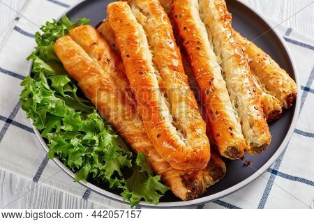 Close-up Puff Pastry Rollini With Spinach, Feta Cheese, Chicken Meat Filling On A Plate, Horizontal 
