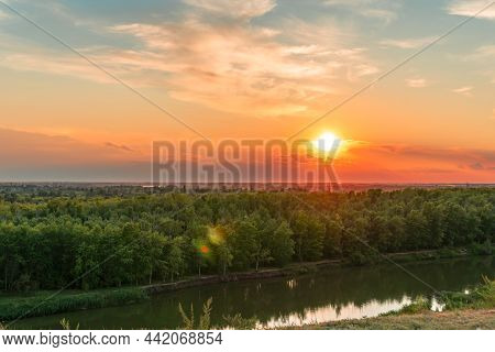 The Heavenly Light Of The Sun Over The River And The Forest.dramatic Evening Sky With Clouds And Ray