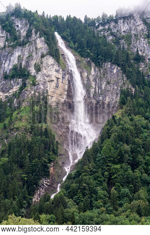 Oltschibachfall Waterfall Near Meiringer In Switzerland. The Water Of The River Oltschibach Plunges 