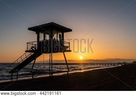 Lifeguard Tower On Mediterranean Beach In Belek Resort Town Of Antalya Province In Turkey, At Sunset