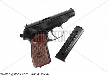 Top View Of A Makarov Pistol And A Separate Magazine For Cartridges. Makarov Pistol On A White Backg