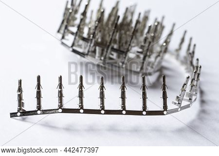 Closeup Of Silver Tinned External Pcb Angular Connectors Over White Background.