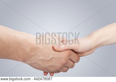 Hands Of Caucasian Couple Connected Together Demonstrating Support And Encuragement Of Two Loving Pe