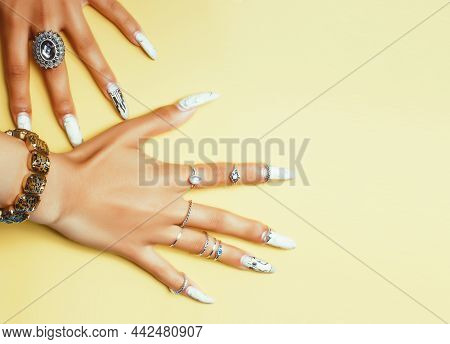 Woman Hands Holding Colorful Paper Copyspace Wearing A Lot Of Jewelry And Long Nails