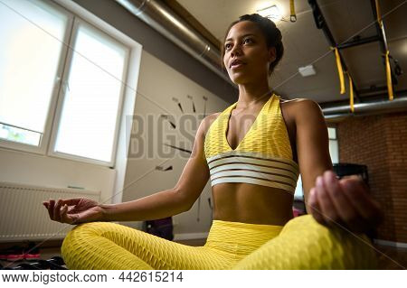 Beautiful Serene Woman With Flat Belly And Healthy Slim Body, Wearing Bright Yellow Tracksuit Sittin