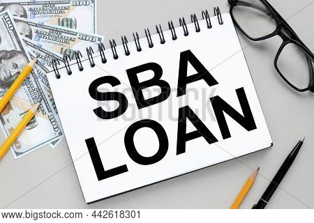 Sba Loan.  Text On Notepad On Gray Background
