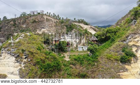 Tourist Standing At The Stairs Of Tree On Rajalima. House Rumah Pohon At Atuh Beach, Nusa Penida, Ba