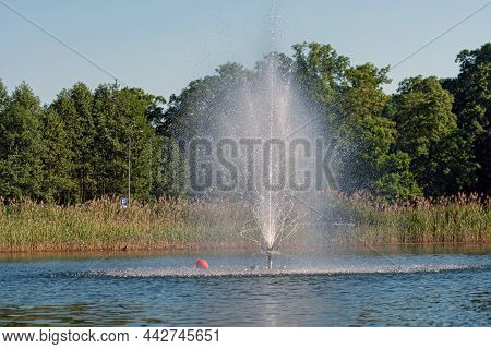 Fountain In Lake Aluksne Near Pilssala On A Sunny Summer Afternoon, Aluksne, Vidzeme, Latvia