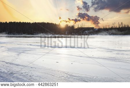 Winter Landscape By The River In Sunset With Light Fog