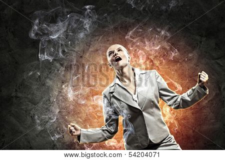 businesswoman in anger screaming against dark grey background