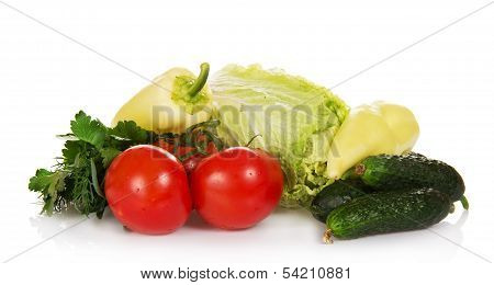 Tomatoes, cucumbers, pepper, greens and the cabbage, isolated on