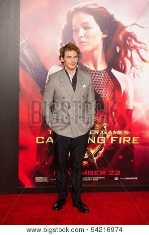 LOS ANGELES, CA - NOVEMBER 18: Actor Sam Claflin arrives at the premiere of The Hunger Games: Catching Fire at the Nokia Theater in Los Angeles, CA on November 18, 2013