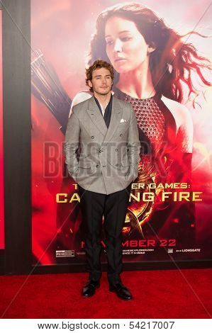 LOS ANGELES, CA - NOVEMBER 18: Actor Sam Claflin arrives at the premiere of The Hunger Games: Catching Fire at the Nokia Theater in Los Angeles, CA on November 18, 2013