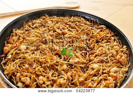 a spanish fideua, a typical noodles casserole with seafood