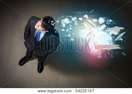 Top view of young businessman making decision