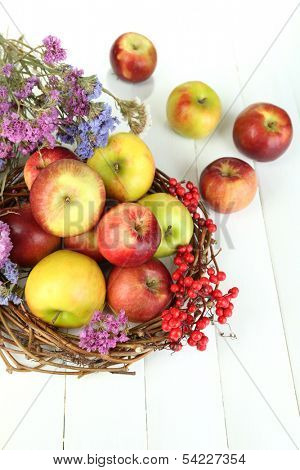Juicy apples on white wooden table