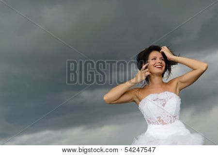 Laughing Woman On A Background Of Clouds