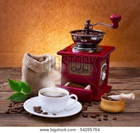 ?up of warm coffee and  grinder.