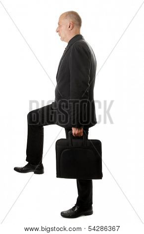 Man with briefcase strides