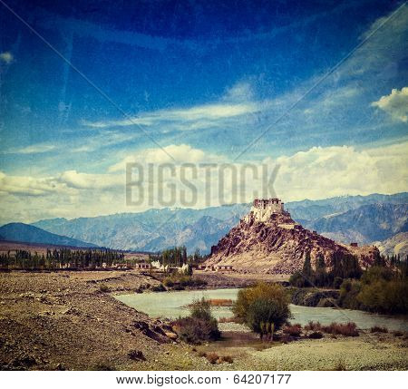 Vintage retro effect filtered hipster style travel image of Stakna Gompa - Buddhist monastery of the Drugpa sect in Leh district, Ladakh, India with grunge texture overlaid