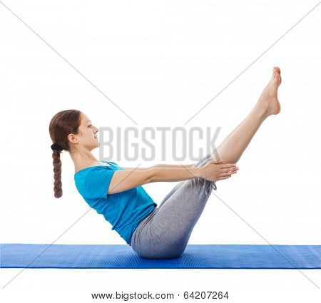 Yoga - young beautiful woman yoga instructor doing Full Boat pose asana (Paripurna navasana) exercise isolated on white background