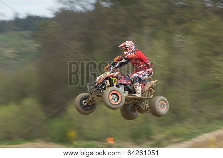 Dynamic Shot Of Quad Racer Jumping