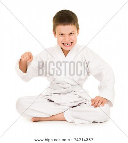boy in white kimono for martial arts posing