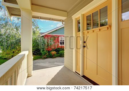 Entrance Porch With Light Yellow Door