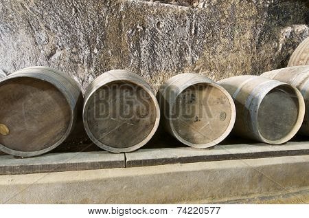 stacked wine barrels in Breze Castle, Loire Valley, France. Built between the 11th and 19th centuries, it houses an extraordinary subterranean complex, a castle in a castle.