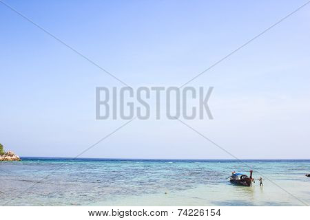 LIPE ISLAND, SATUN, THAILAND - SEP29, 2014: Fisherman Sailed Longtail Boat On The Beach