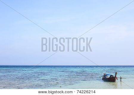 LIPE ISLAND, SATUN, THAILAND - SEP29, 2014: Fisherman Sailed Longtail Boat On The Beach