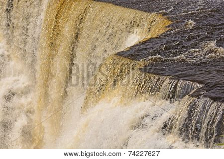 Dramatic Water At The Brink Of A Falls