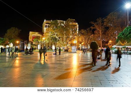 Tourists Walk On Promenade In Yalta City In Night