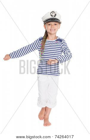 Marching mischievous girl in costume cabin boy. Girl is six years old. On her cap emblem of Russia. 