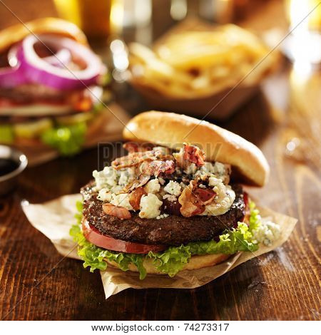 gourmet bacon and bleu cheese burgers with beer