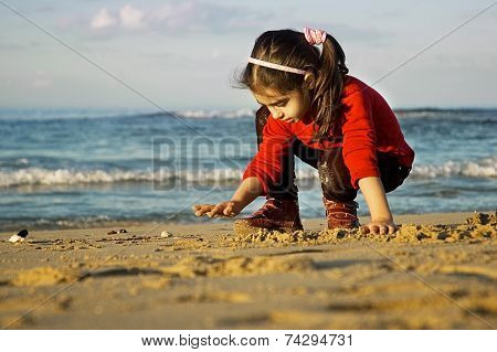 Child Play On The Beach