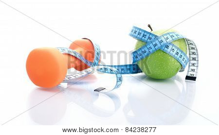 Dumbbell With Apple And Measure Tape, Isolated On White