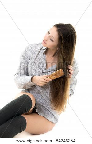Gorgeous Model Combing Her Hair In Shirt And Spats