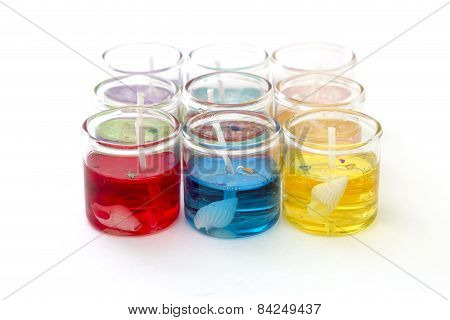 Candles In Glass In A Row On Top Of The White