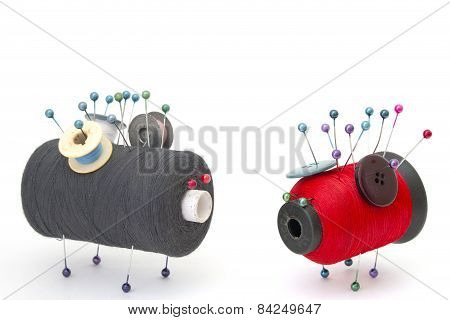 Toys Thread Looking At Each Other On A White Background