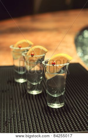 Three Tequila Shots With Lemon
