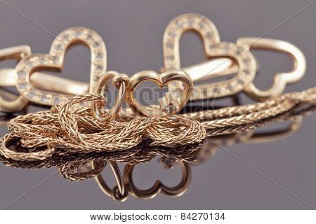 gold jewelry in the shape of hearts