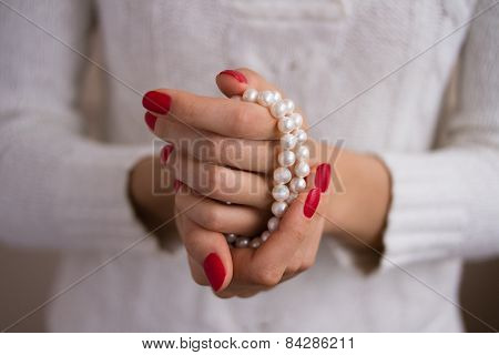 Pearls In Female Hands